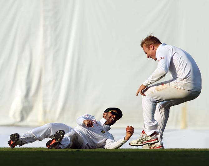 South Africa's JP Duminy takes a brilliant catch to cut short India's Wriddhiman Saha's innings in the Nagpur Test 