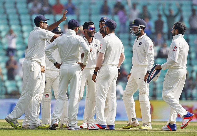 India's Ravindra Jadeja (centre) celebrates with team-mates after dismissing South Africa's Faf du Plessis on the second day of the third Test match in Nagpur on Wednesday