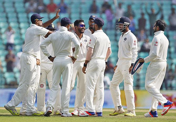 India's Ravindra Jadeja (centre) celebrates with team-mates after dismissing South Africa's Faf du Plessis on the second day of the third Test match in Nagpur on Wednesday