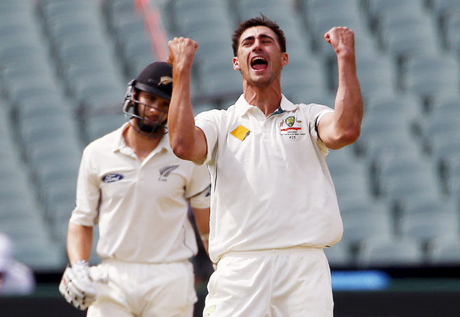 Australia's Mitchell Starc celebrates dismissing New Zealand's Kane Williamson LBW for 22 runs during the first day of the third cricket Test at the Adelaide Oval, in South Australia on Friday