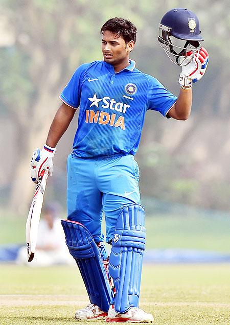 Indian U-19 cricketer Rishabh Pant celebrates his century aganist Afghanistan during their U-19 Tri Series match at Salt Lake in Kolkata on Friday