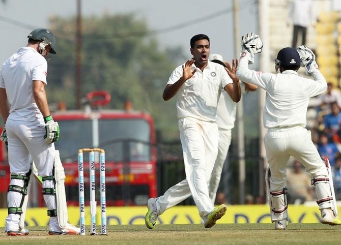 Ravichandran Ashwin celebrates the wicket of South Africa's AB de Villiers.