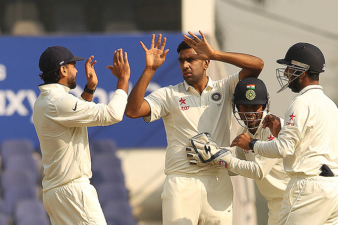 India's Ravichandran Ashwin celebrates the wicket of Hashim Amla 