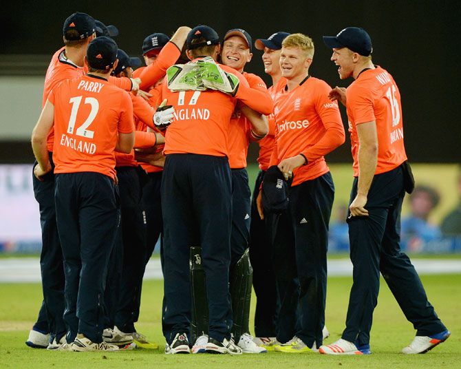 England players celebrate after defeating Pakistan in the the 2nd International T20 and clinching the series at Dubai Cricket Stadium in Dubai on Friday