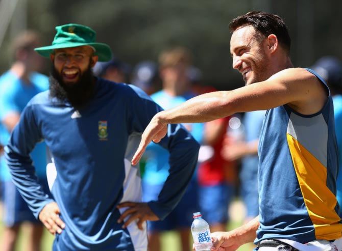 Hasim Amla (left) and captain Faf du Plessis share a joke during a South Africa nets session