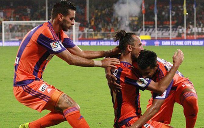 Tuncay Sanli celebrates after scoring