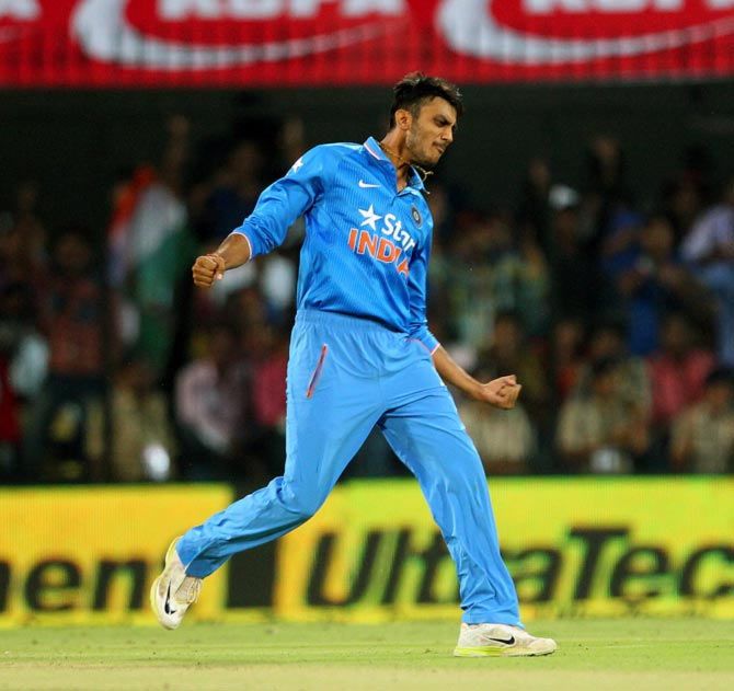 Axar Patel celebrates a wicket. 