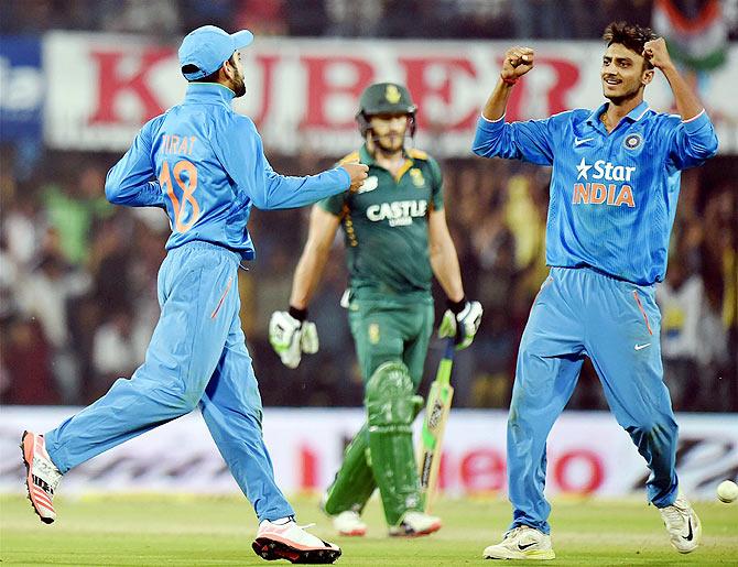 India's Axar Patel celebrates the wicket of South Africa's Faf du Plessis during the 2nd ODI match at Holkar Cricket Stadium in Indore on Wednesday