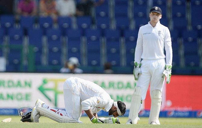 Shoaib Malik of Pakistan prays after reaching his double century during day two of the 1st Test between Pakistan and England at Zayed Cricket Stadium on Wednesday