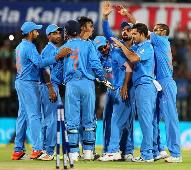 India's players celebrate the fall of a South Africa wicket in the second ODI in Indore