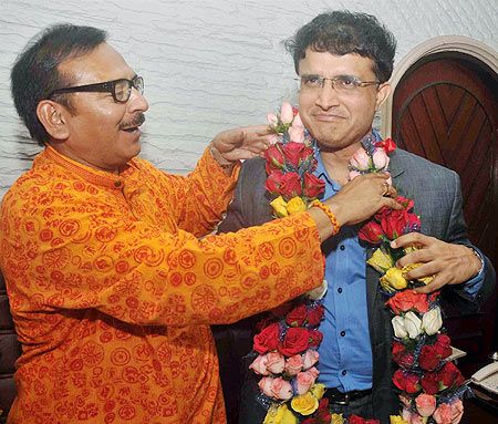 Image: Newly elected CAB President Sourav Ganguly being felicitated by West Bengal Youth Affairs Minister Arup Biswas (left) after the CAB Annual General Meeting in Kolkata on Thursday