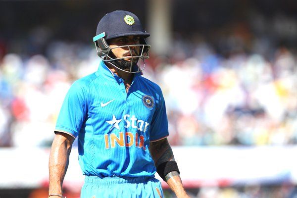 England's Virat Kohli of India departs after being run out 