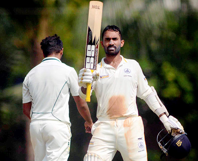 Dinesh Karthik of Tamil Nadu raises bat during his 167 runs against Mumbai 