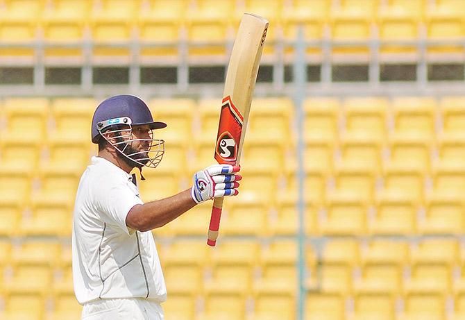 Waseem Jaffer of Vidharba celebrates his half century against Karnataka  