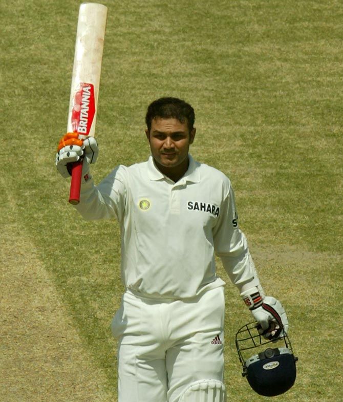 Virender Sehwag celebrates after hitting a triple century against Pakistan in Multan, in March 2004