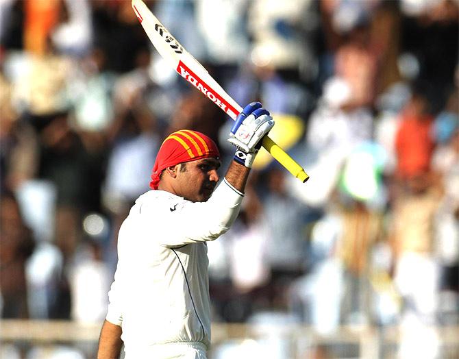 Virender Sehwag celebrates his 300 runs  