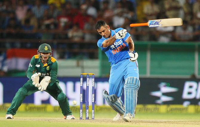 India captain,  Mahendra Singh Dhoni loses his bat during the 3rd One-Day International against South Africa in Rajkot on Sunday