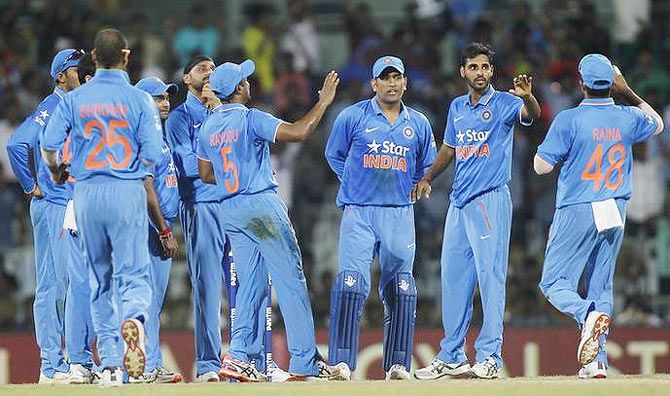 India's Bhuvneshwar Kumar celebrates with teammates after dismissing South Africa's AB de Villiers
