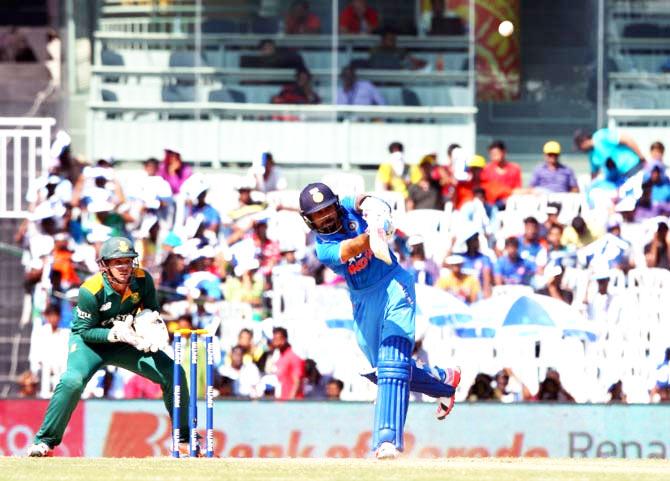 Virat Kohli hits a six off Aaron Phangiso