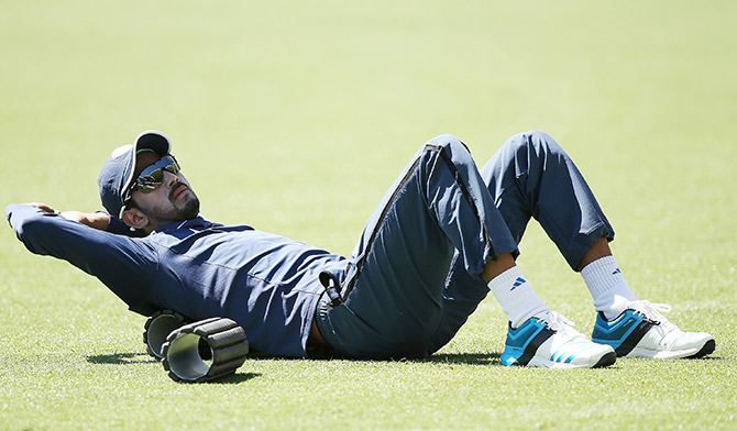KL Rahul of India stretches during a training session 