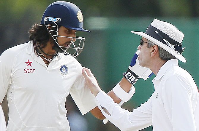 Umpire Nigel Llong (right) speaks with India's Ishant Sharma after an argument between Sharma and Sri Lanka's bowler Dhammika Prasad (not pictured) during the fourth day of the third and final Test match in Colombo on Monday