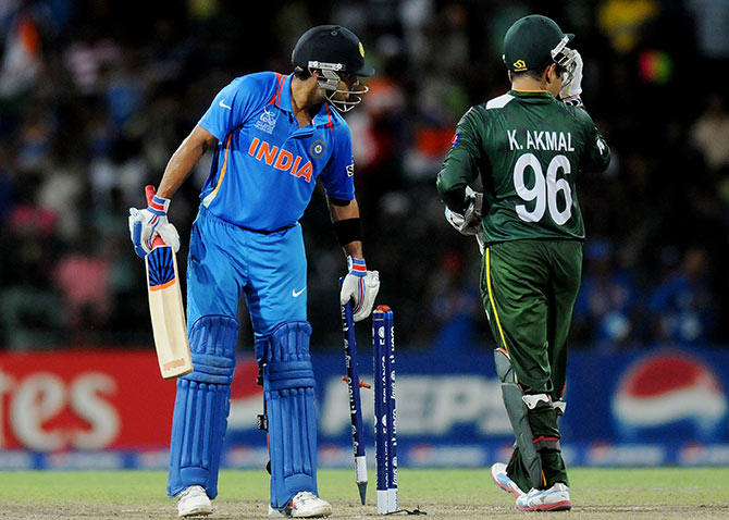 Virat Kohli of India takes a stump as he celebrates victory against Pakistan 