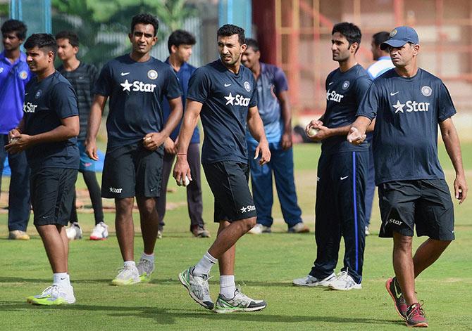 Coach Rahul Dravid, extreme right, with India 'A' team members Jayant Yadav, Rishi Dhawan, Gurkeerat Mann and Karan Sharma during a training session ahead of the ODI series against Bangladesh 'A' at the National Cricket Academy in Bengaluru. Photograph: PTI