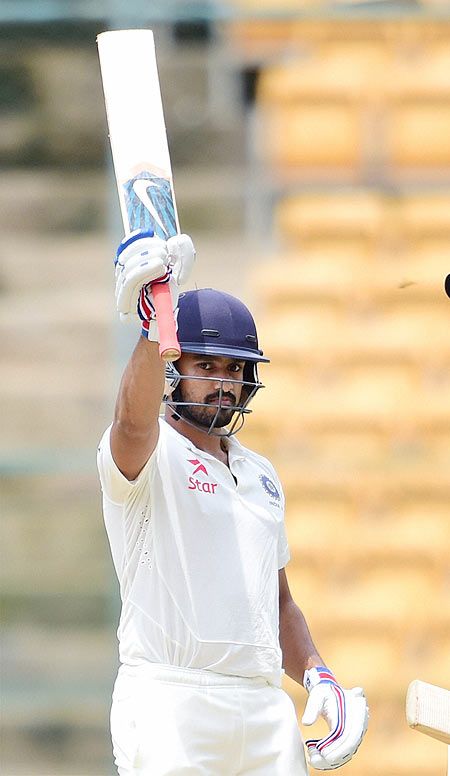India A cricketer Karun Nair celebrates his fifty runs on day two of the three day match against Bangladesh A at Chinnaswamy Stadium in Bengaluru on Monday
