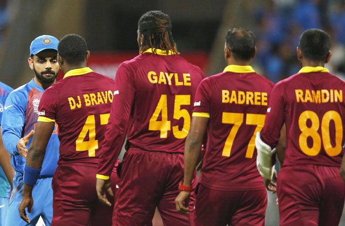 Virat Kohli congratulates West Indies players after their World T20 semi-final on Thursday
