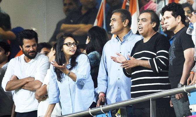 Indian batting maestro Sachin Tendulkar (extreme right) watches the match along with industrialist Mukesh Ambani (2nd from right), politician Praful Patel (3rd from right) and Bollywood star Anil Kapoor (left)