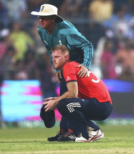 England's Ben Stokes is consoled by coach Trevor Bayliss 