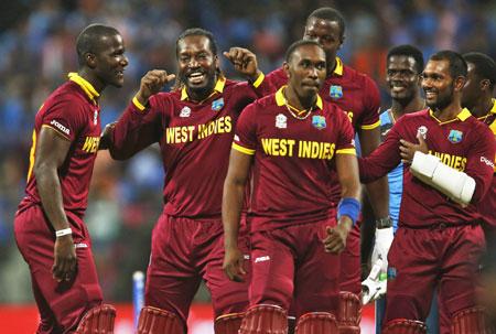 West Indies players celebrate after winning their match