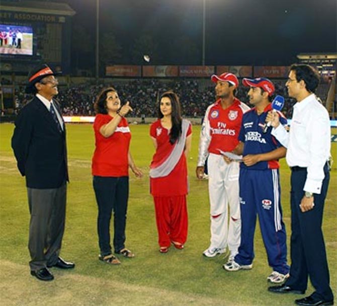 Harsha Bhogle, right, at the toss before an IPL game.