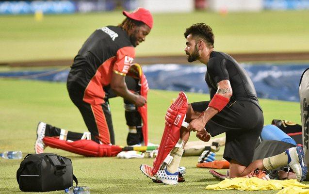 Royal Challengers Bangalore skipper Virat Kohli and Chris Gayle during a training session