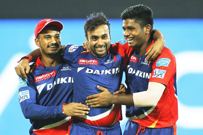 The Delhi Daredevils' Amit Mishra, Pawan Negi and Sanju Samson celebrate the wicket of Kings XI Punjab's Glenn Maxwell on Friday