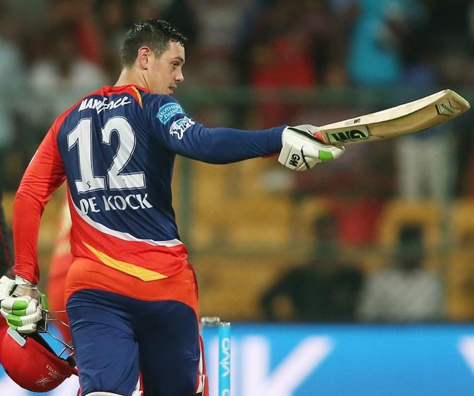 Delhi Daredevils’s Quinton de Kock celebrates reaching his century against Royal Challengers Bangalore