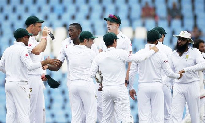 South Africa's cricketers celebrate during a Test match