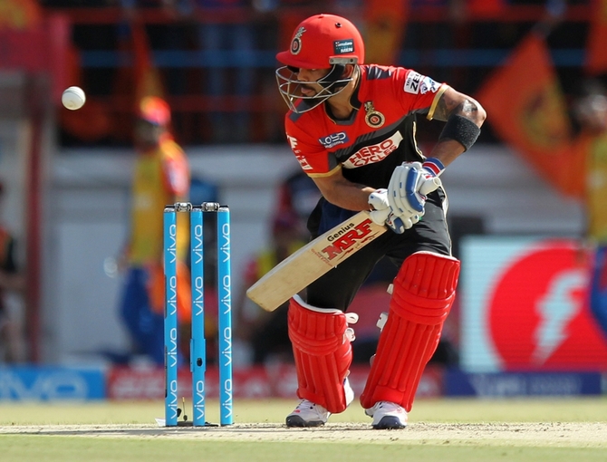 RCB's Virat Kohli bats en route his century