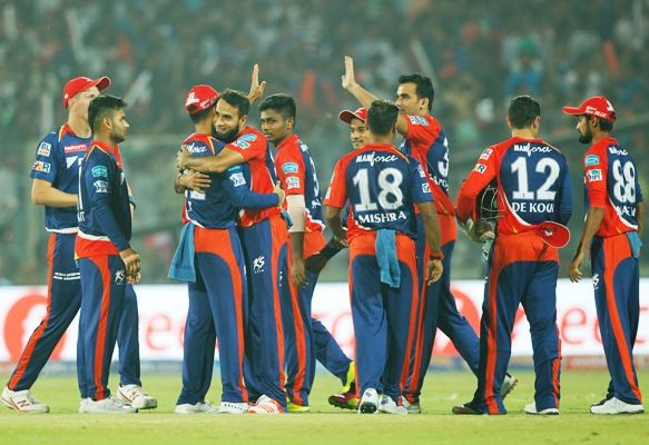 Delhi Daredevils' Imran Tahir celebrates with teammates after taking a wicket