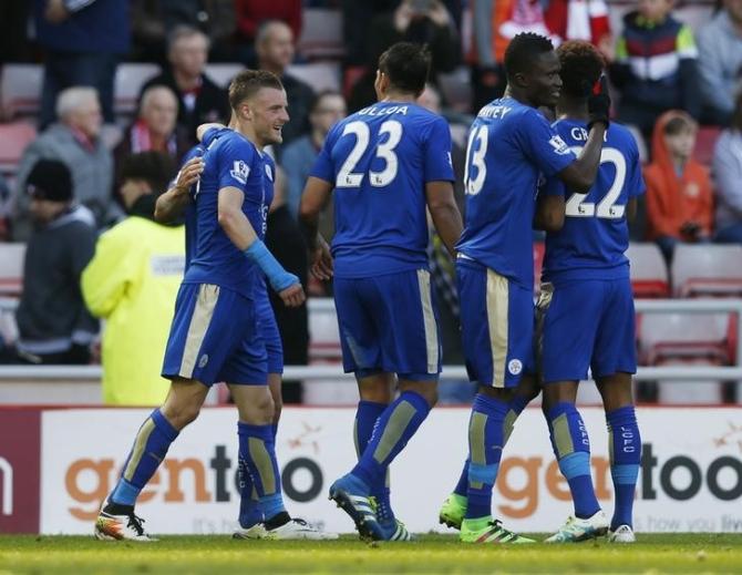 Jamie Vardy celebrates with team mates after scoring the second goal for Leicester