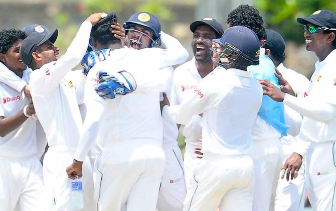 Rangana Herath celebrates with team-mates. Photograph: Twitter