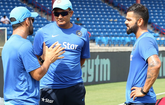 Dhoni with coach Anil Kumble and Virat Kohli. Photograph: BCCI