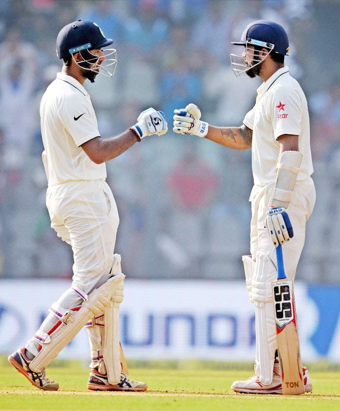 Cheteshwar Pujara and Murali Vijay were involved in a 107-run unbroken second wicket stand against England on Day 2 of the 4th Test in Mumbai on Friday