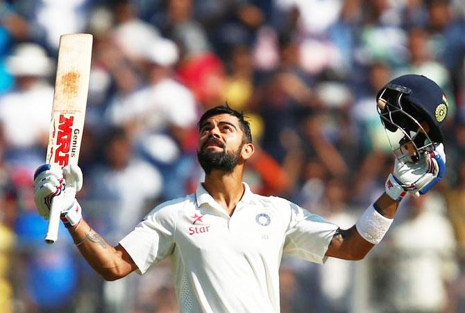 Virat Kohli celebrates on completing his double century in Mumbai on Sunday