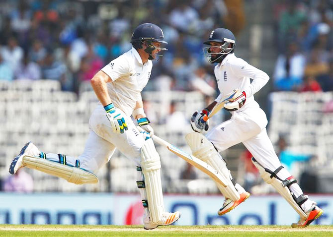 England's Adil Rashid (R) and Liam Dawson run between wickets on Day 2 of the 5th Test in Chennai on Saturday