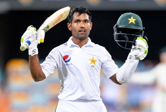 Pakistan's Asad Shafiq celebrates scoring a century on Day 4 of the First Test against Australia at The Gabba in Brisbane on Sunday