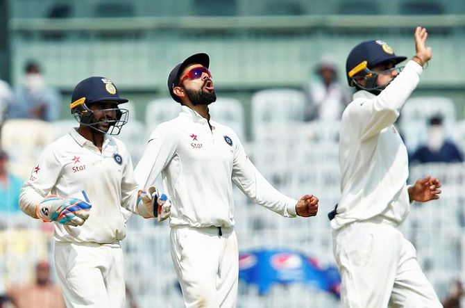 India's captain Virat Kohli celebrates with teammates after England's Keaton Jennings was caught and bowled by Ravindra Jadeja