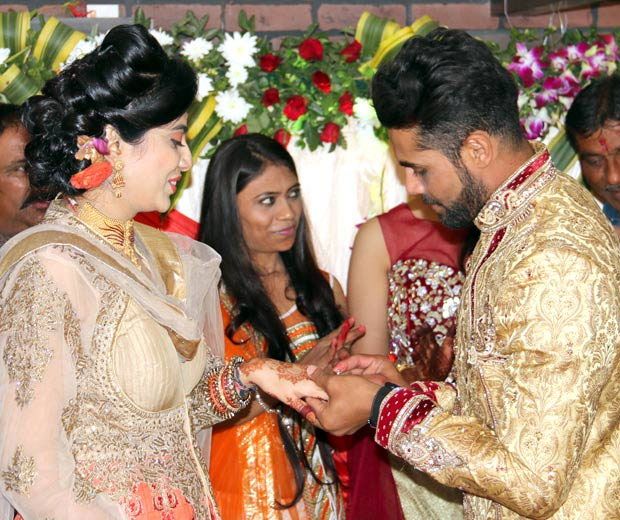 Riva Solanki and Ravindra Jadeja  exchange rings at the engagement