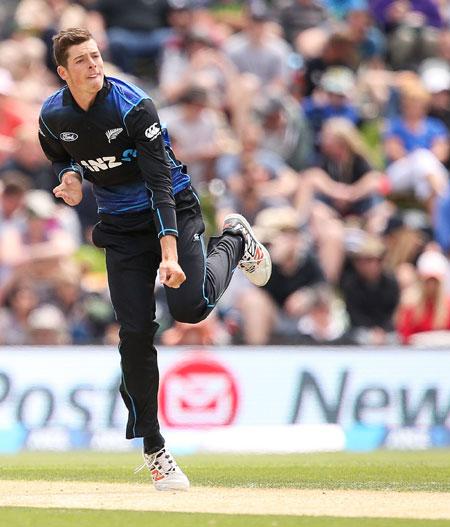 New Zealand's Mitchell Santner bowls 