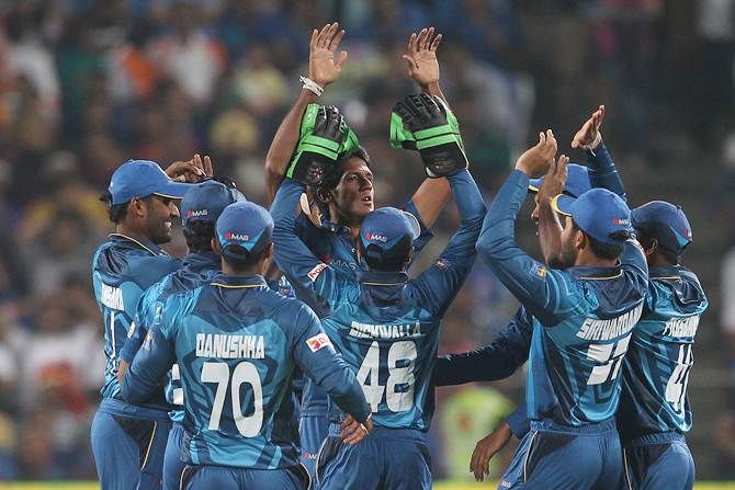 Sri Lanka pacer Kasun Rajitha celebrates after dismissing Rohit Sharma in the first T20 against India in Pune on Tuesday.